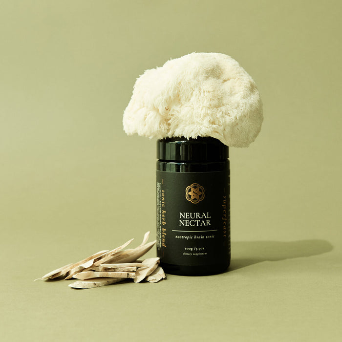 Black container labeled 'Neural Nectar' with a cauliflower on a beige background