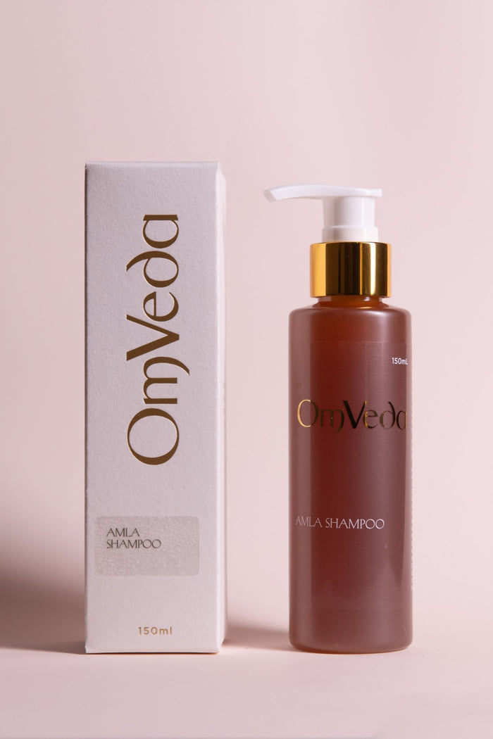OmVeda amla shampoo bottle and box, brown bottle with gold pump