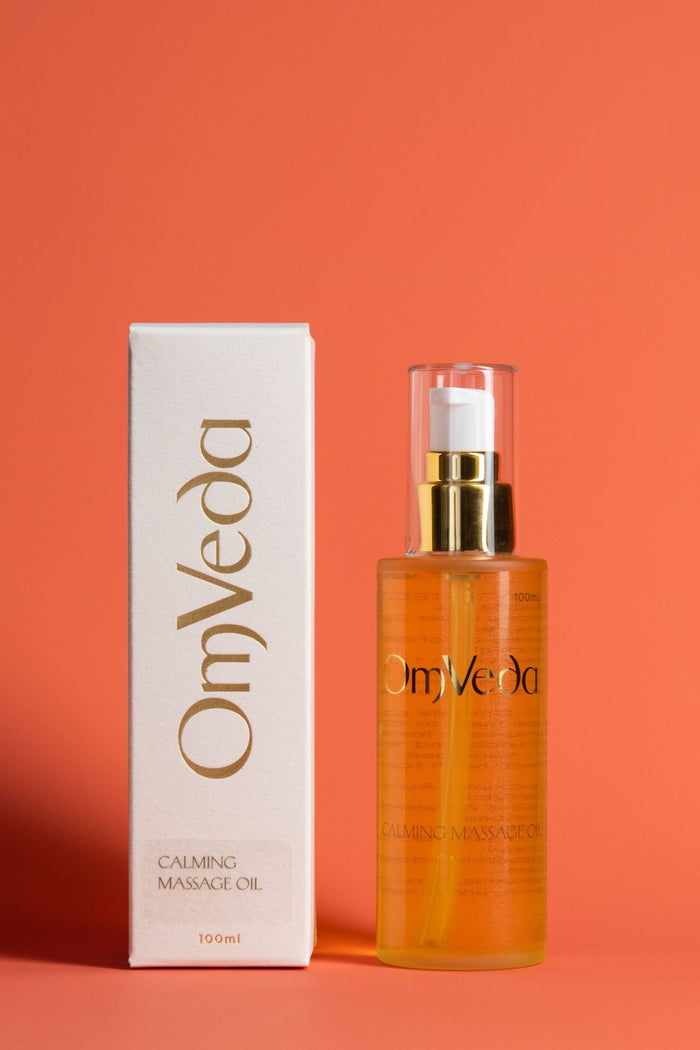 Calming massage oil bottle with gold pump and box, amber glass, OmVeda Professional 100ml