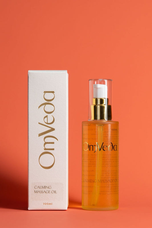 Calming massage oil bottle with gold pump and box, amber glass, OmVeda Professional 100ml