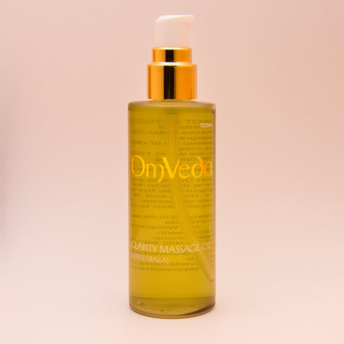 Body oil bottle, 100ml, amber liquid with gold pump and OmVeda label
