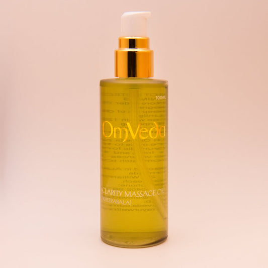 Body oil bottle, 100ml, amber liquid with gold pump and OmVeda label