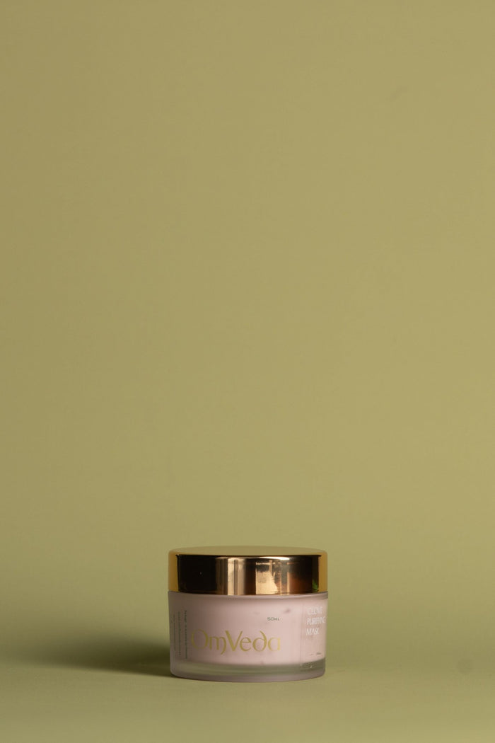 OmVeda clove purifying face mask jar with gold lid