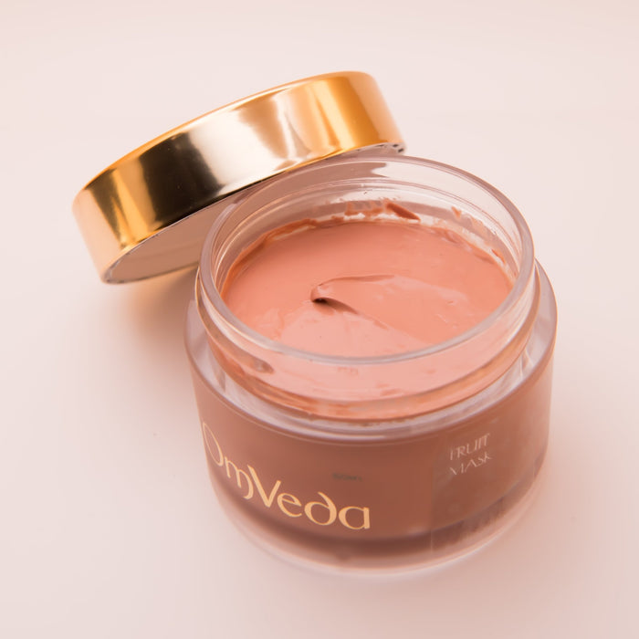 OmVeda Fruit Mask 50ml jar open with gold lid, pink cream inside