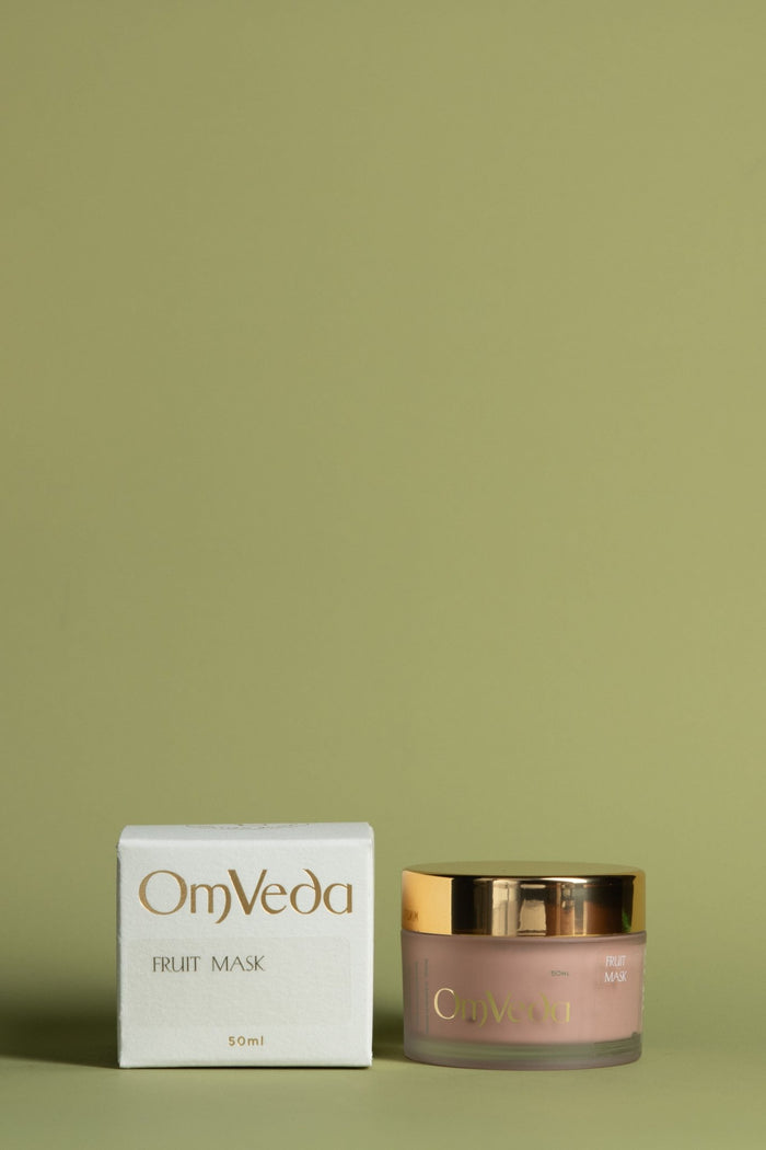 OmVeda fruit mask: white box and pink jar with gold lid