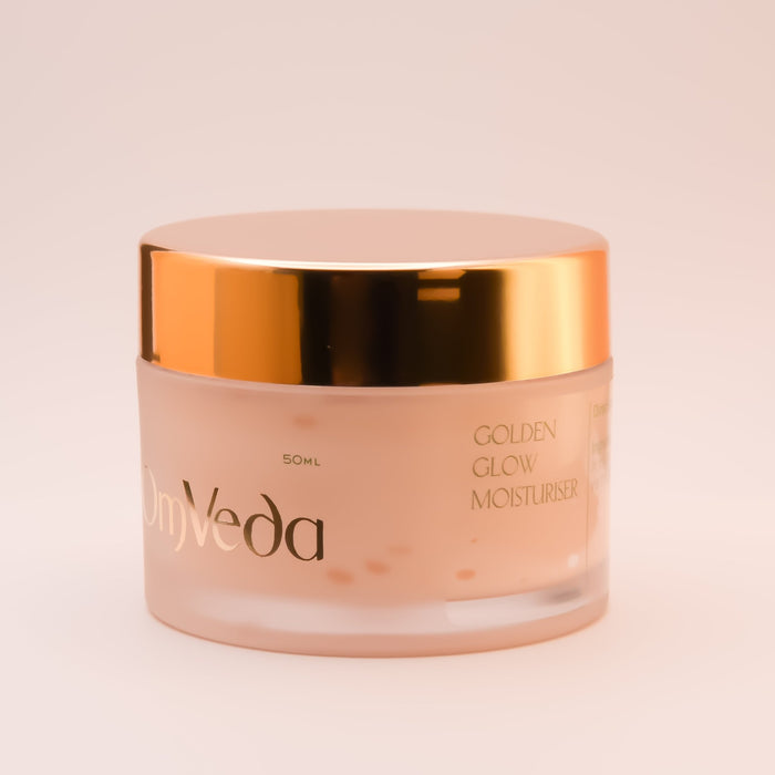 OmVeda Golden Glow moisturiser jar, cream body and gold cap, 50 ml