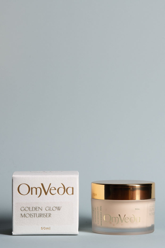 OmVeda Golden Glow moisturiser box and gold-lidded jar, 50 ml