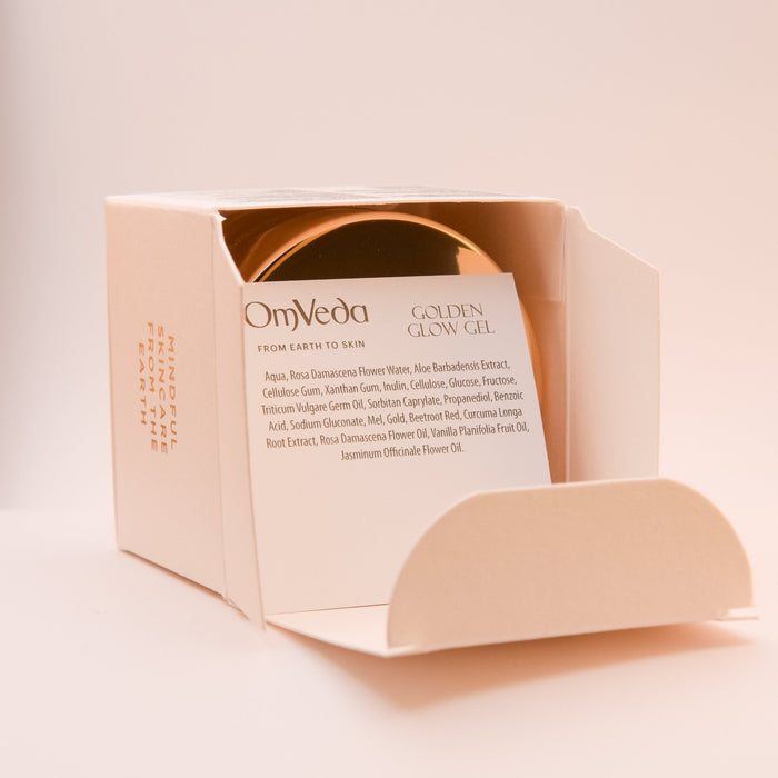 OmVeda Golden Glow treatment gel box open with inner product insert