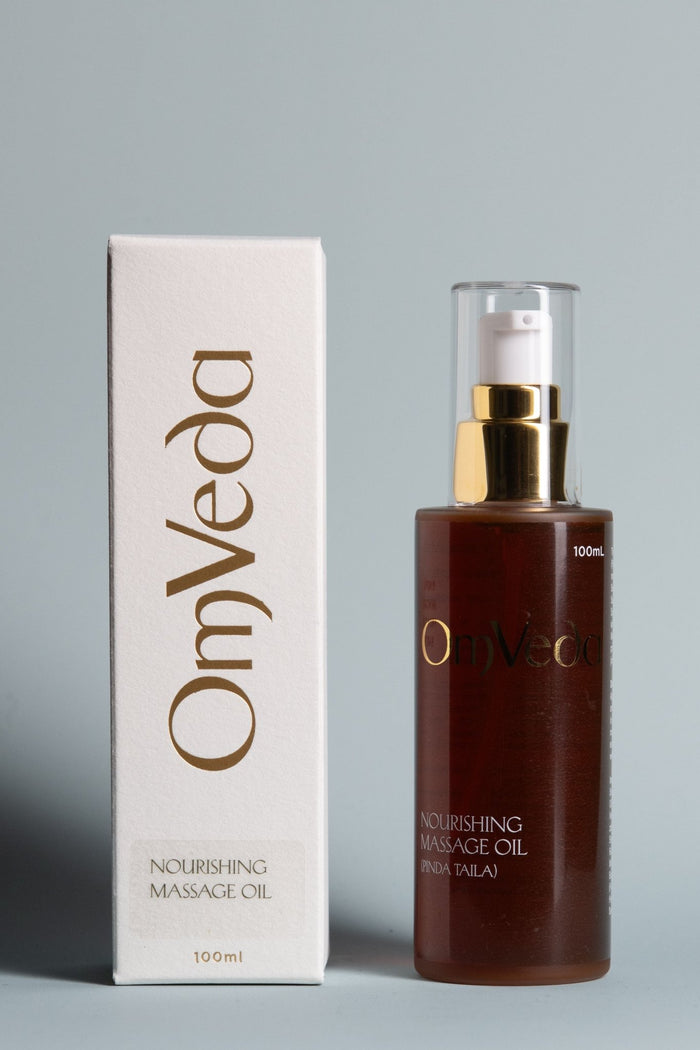 OmVeda Nourishing Pinda Massage Oil bottle and 100ml box, glass with gold pump