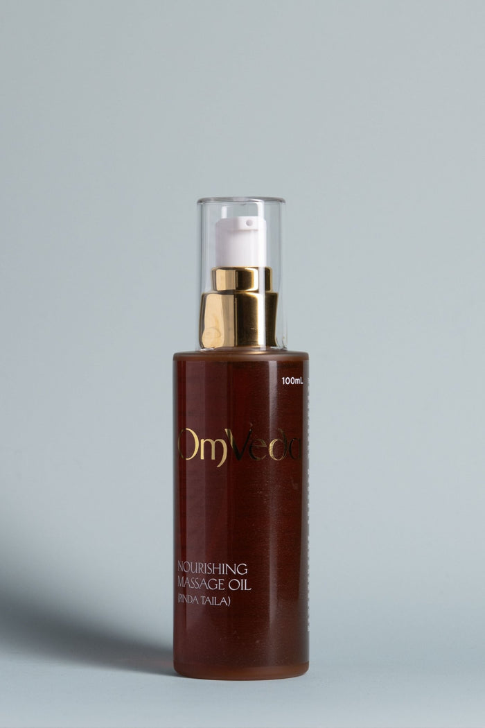 OmVeda Nourishing Pinda Massage Oil bottle, dark amber glass with gold pump and 100ml