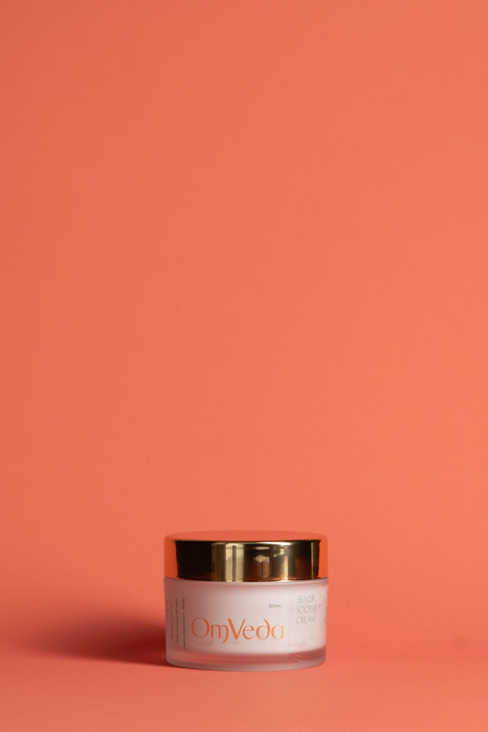 OmVeda Silver Soothe Cream jar with gold lid and silver-toned label, 250ml