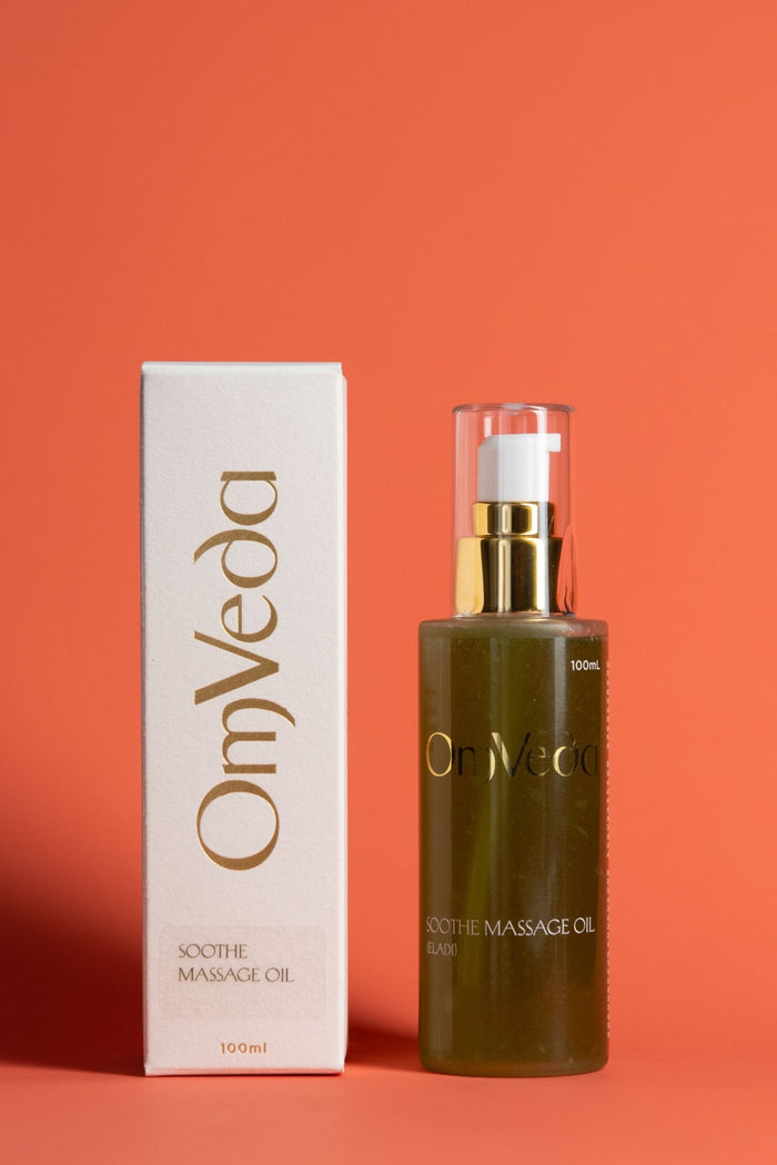OmVeda Soothe Eladi massage oil bottle with pump and box, dark green liquid