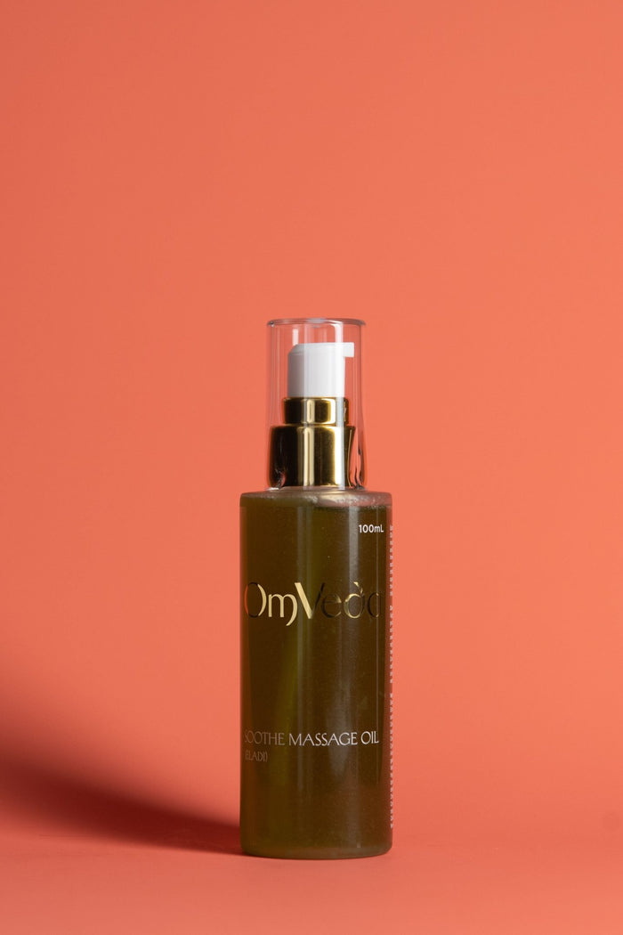 OmVeda Soothe Eladi massage oil bottle with pump, dark green liquid