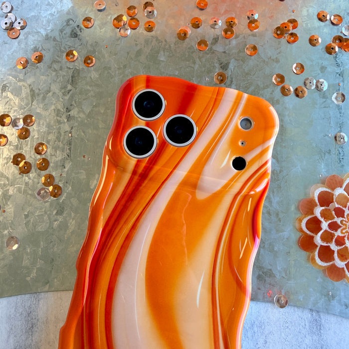 Orange Crush MagSafe iPhone case with swirled marble pattern in sunset orange by Fancy Bands