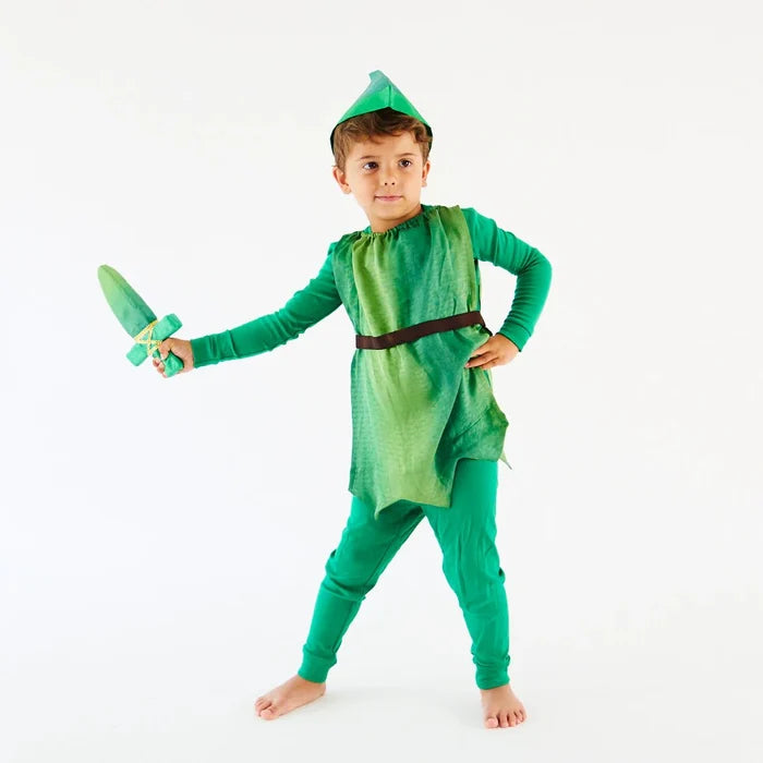 Child in a green Peter Pan hat and tunic holding a toy sword on a white background