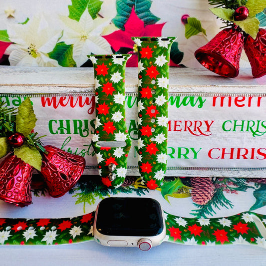 Close-up of Poinsettia Pines print showing vibrant red flowers, white blooms, and lush green pine on Apple Watch silicone band