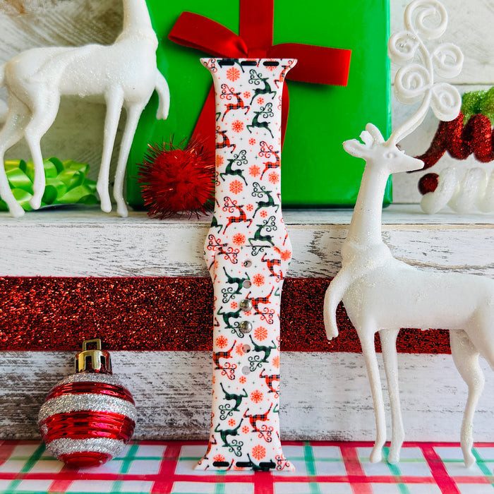 Reindeer Waltz Apple Watch band with dancing reindeer in red and green on white background with Christmas decorations