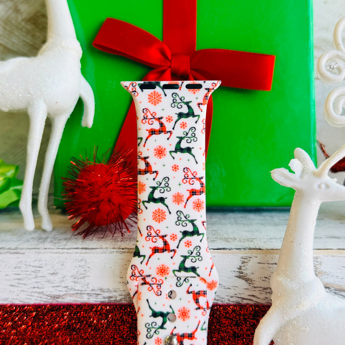 Reindeer Waltz Apple Watch band with dancing reindeer in red and green on white background with Christmas decorations