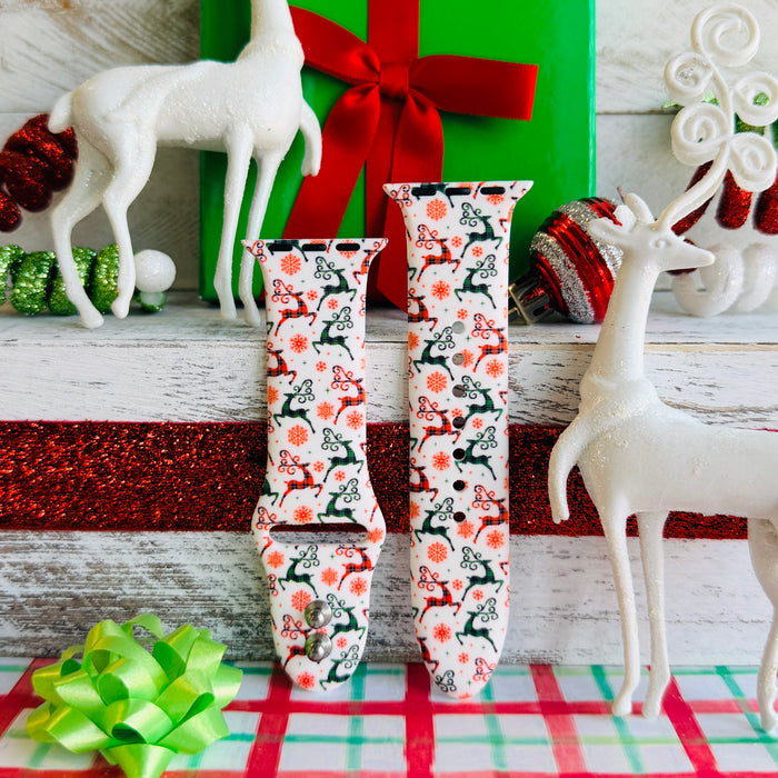 Reindeer Waltz Apple Watch band with dancing reindeer in red and green on white background with Christmas decorations