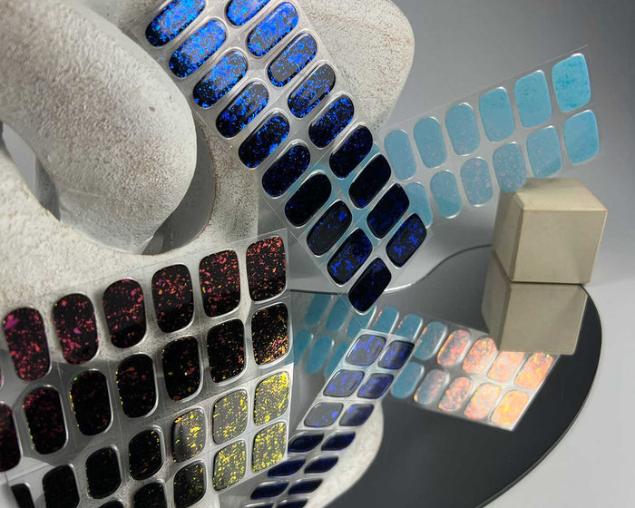 Frozen Speckle semi-cured gel nail wraps on a nail mock-up, another angle