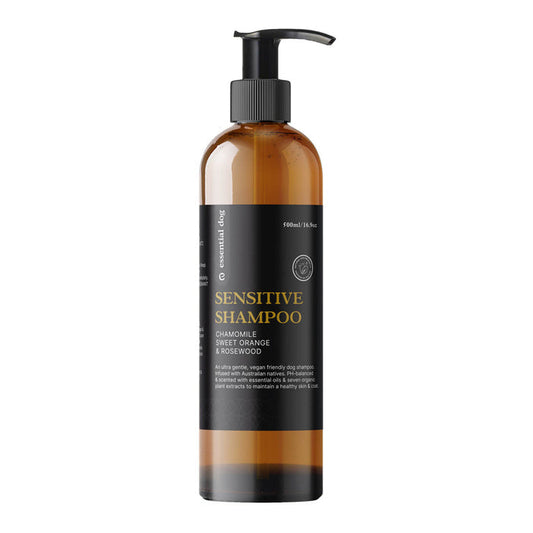 Sensitive dog shampoo bottle with pump on a white background.