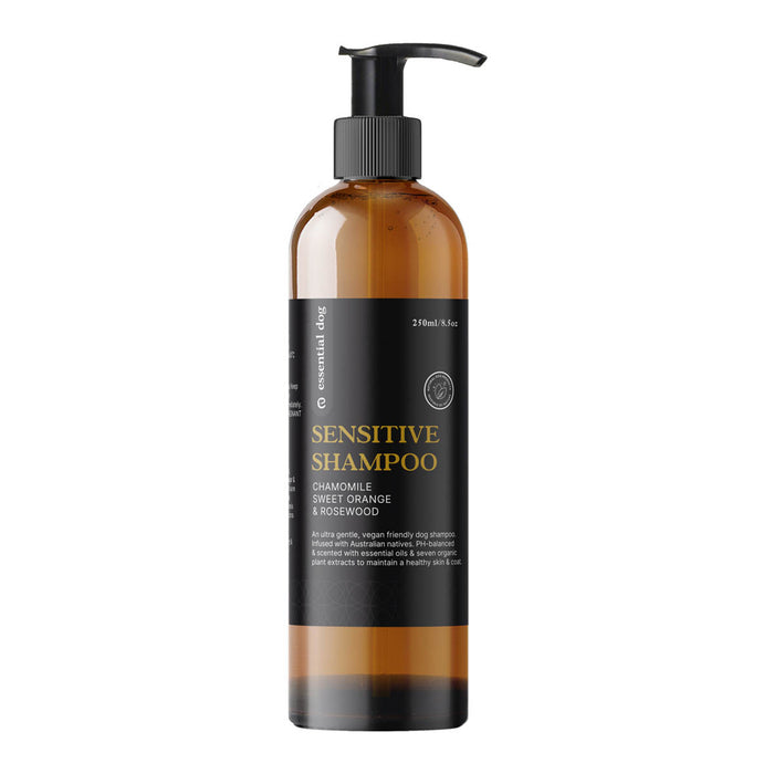 Sensitive dog shampoo bottle with pump on a white background.
