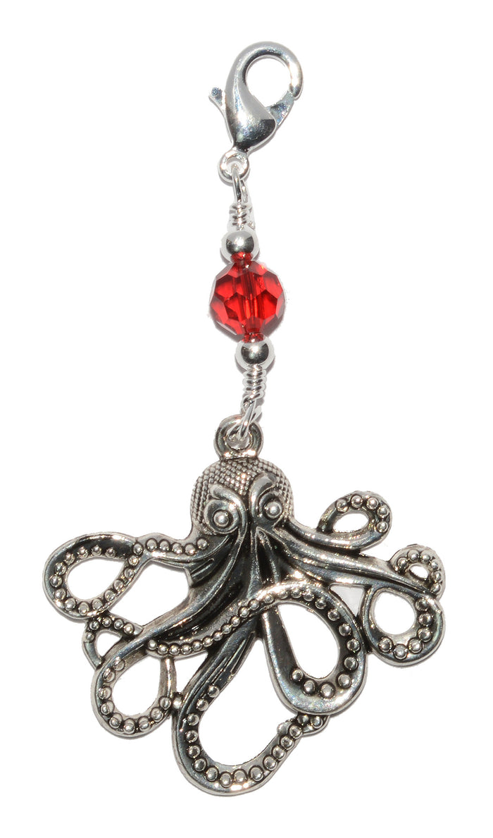 Silver Cthulhu octopus charm large hair accessory with red glass bead on white background