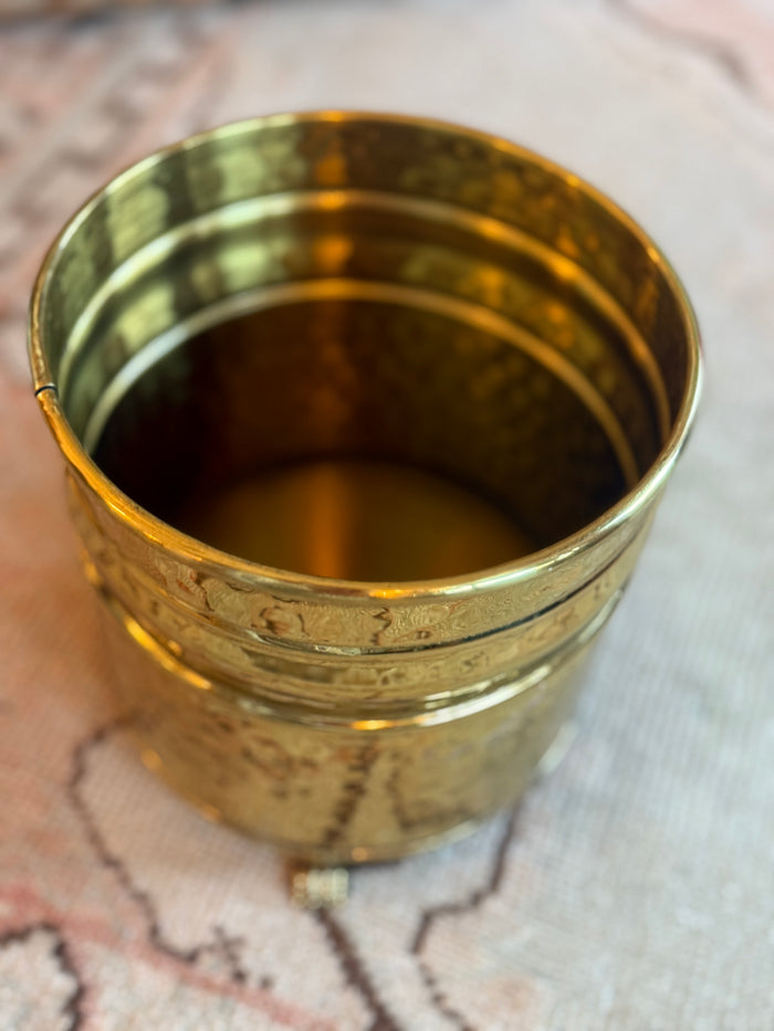 Brass cup on a textured surface