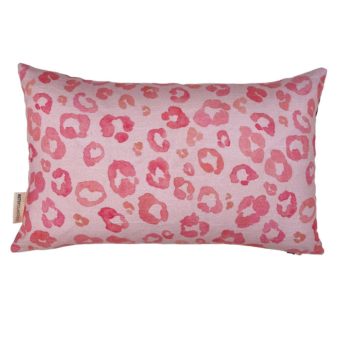Pink leopard print pillow on a white background