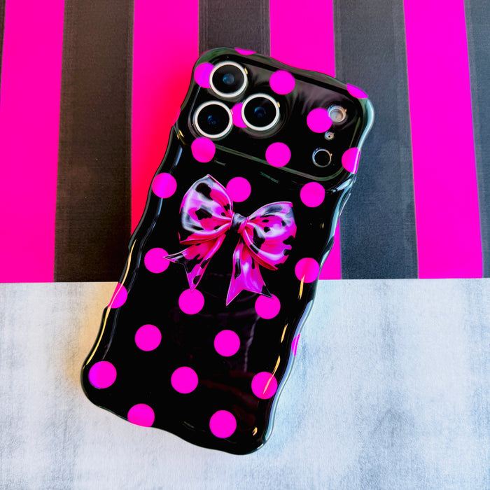Sweet Spot MagSafe iPhone case with hot pink polka dots and cowhide bow on black by Fancy Bands