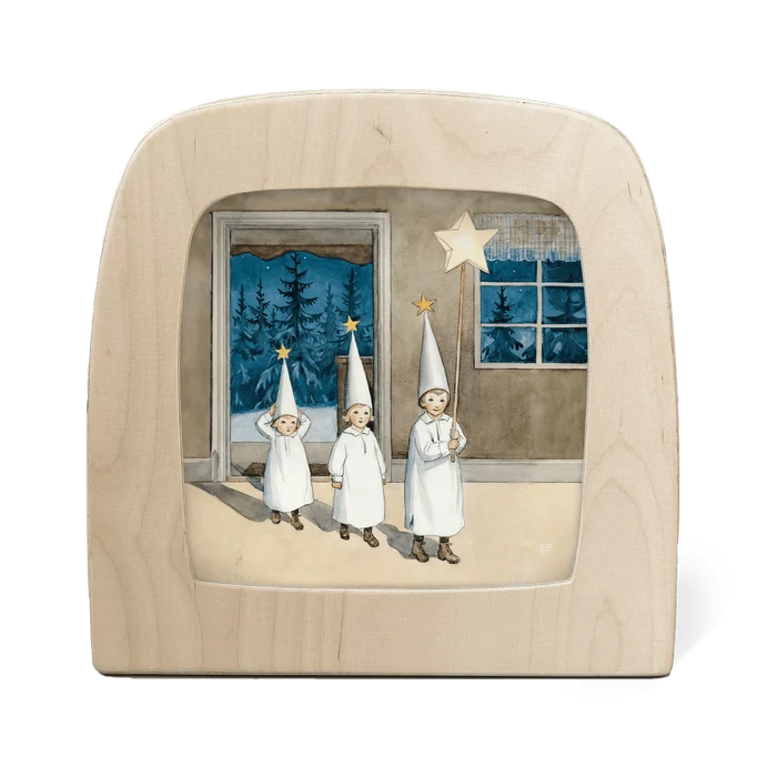 Silhouette of three children in white outfits and hats holding stars, set against a window view of trees.