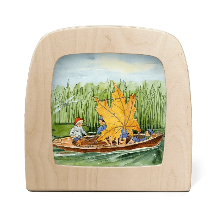Wooden frame with a painted scene of children in a boat with a leaf sail on a white background