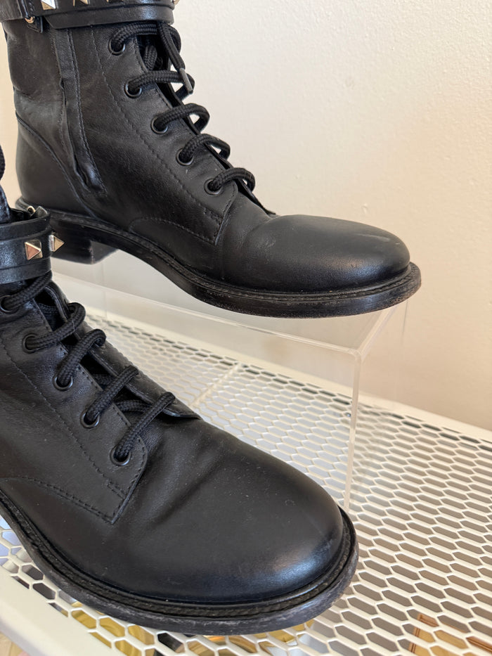 Valentino Rock Stud Combat Boots in size 38.5, black leather with studded detailing, styled for a bold, edgy look.