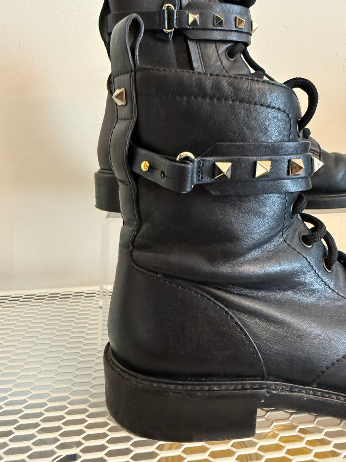 Valentino Rock Stud Combat Boots in size 38.5, featuring black leather with signature stud embellishments and rugged combat style.