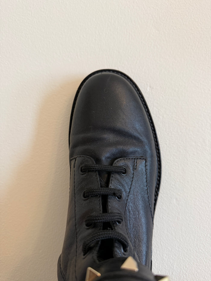 Valentino Rock Stud Combat Boots in size 38.5 with studded detailing, black leather, and chunky sole.