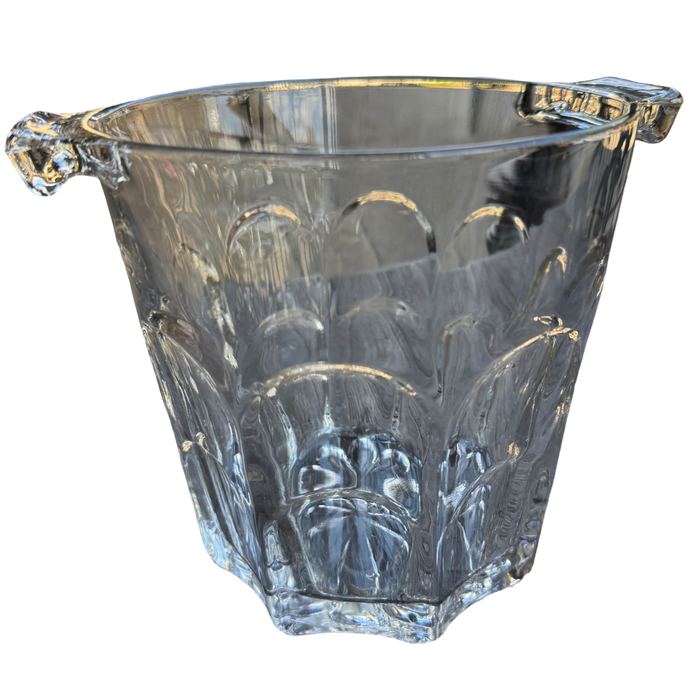 Clear glass ice bucket with decorative handles on a white background