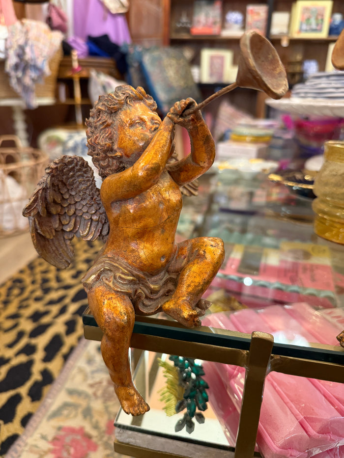 Decorative angel figurine with gold and brown finish on a stand.