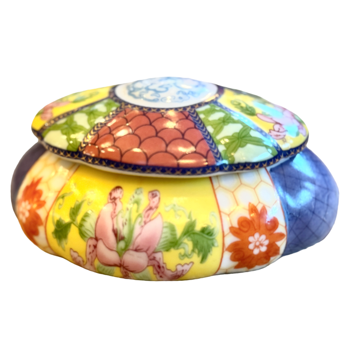 Decorative ceramic jar with colorful design on a white background