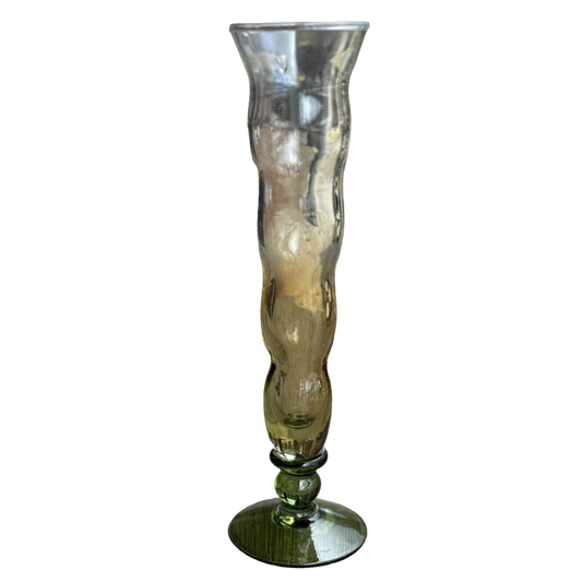 Tall, ribbed glass vase on a white background