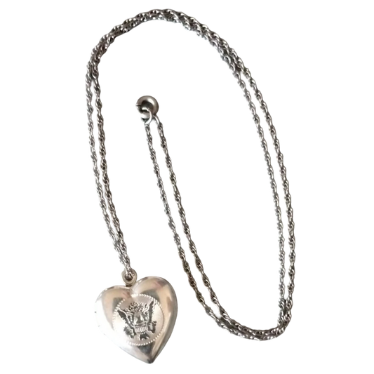 Silver heart-shaped pendant necklace on a white background