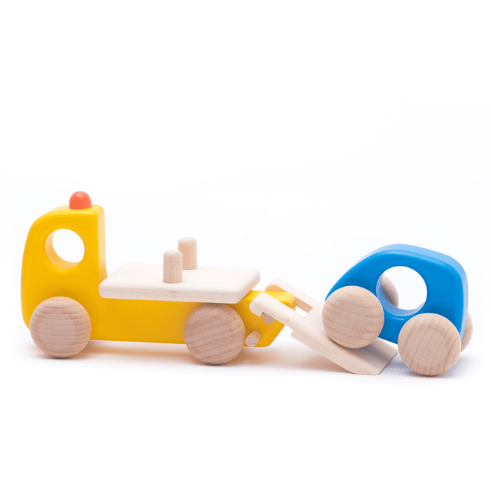 Yellow toy tow truck loading a blue car on a white background